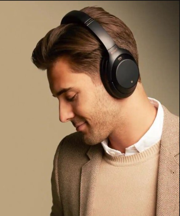 A man wearning a headphone sony wh-1000xm4